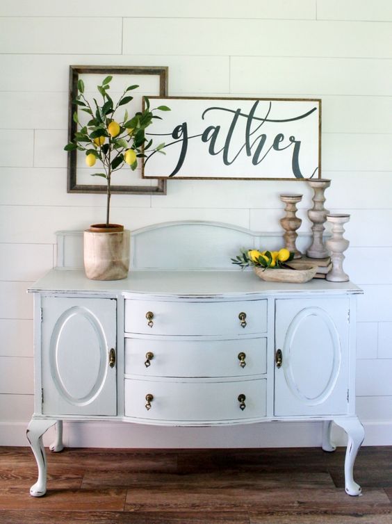 Pretty shiplap wall! Love the vintage hutch and lemon tree decor!