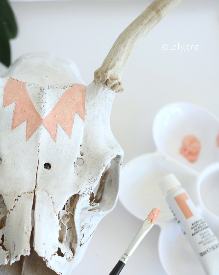 Add a sketched aztec design + acrylic paint onto a skull and in just minutes you have a chic piece of decor!