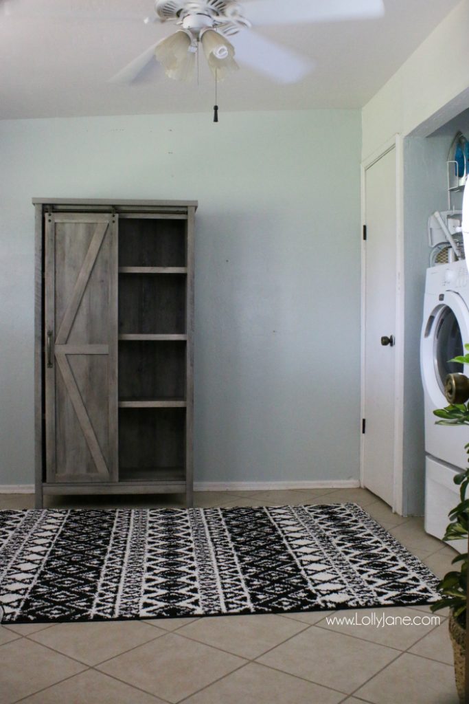 This modern farmhouse storage unit is so cute! LOVE this farmhouse barndoor cabinet!