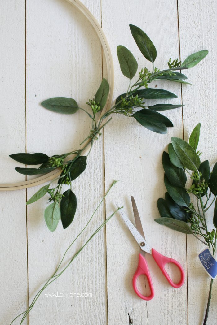 Love this pretty fall wreath with eucalyptus leaves and faux pumpkins. Such a pretty fall wreath with an easy fall craft tutorial!