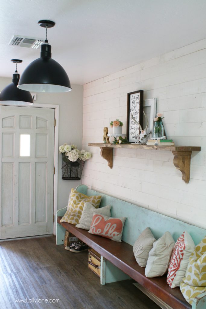 Such a fun farmhouse makeover: the shiplap entrway, black barn light pendants and farmhouse accessories really makeover this space.