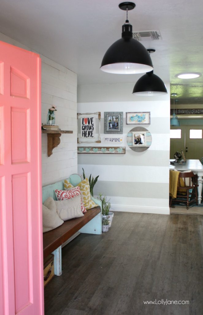 Loving this reclaimed wood wall against the striped accent hallway. Check out this easy way to shiplap your wall, brilliant peel and stick wood pieces!