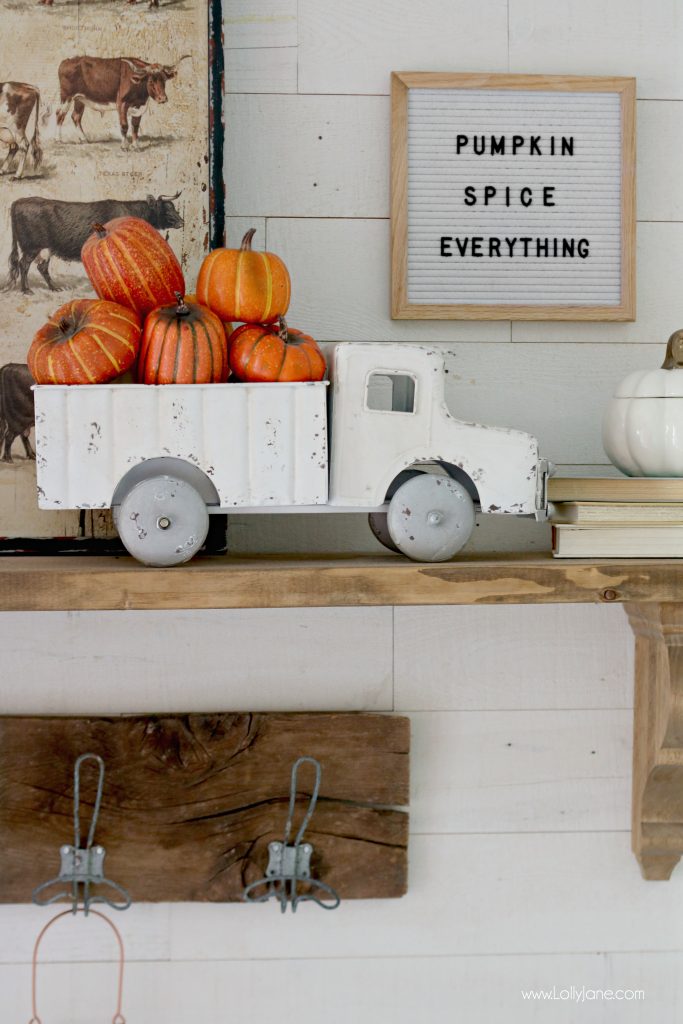 Cute Fall Mantel, love the Vintage Truck with Faux Pumpkins + Gourds. "Pumpkin Spice Everything" letter board is perfect for this space!