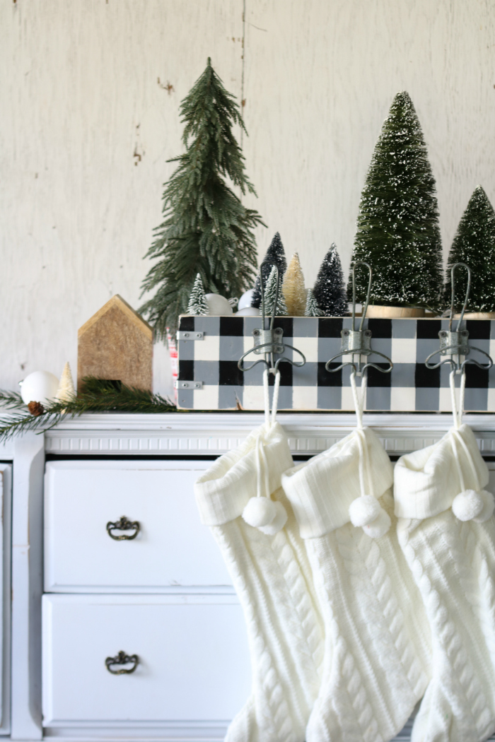 Love this easy buffalo check Christmas stocking hanger! Make this easy wood box, paint, add hooks to display stockings PLUS Christmas decor!