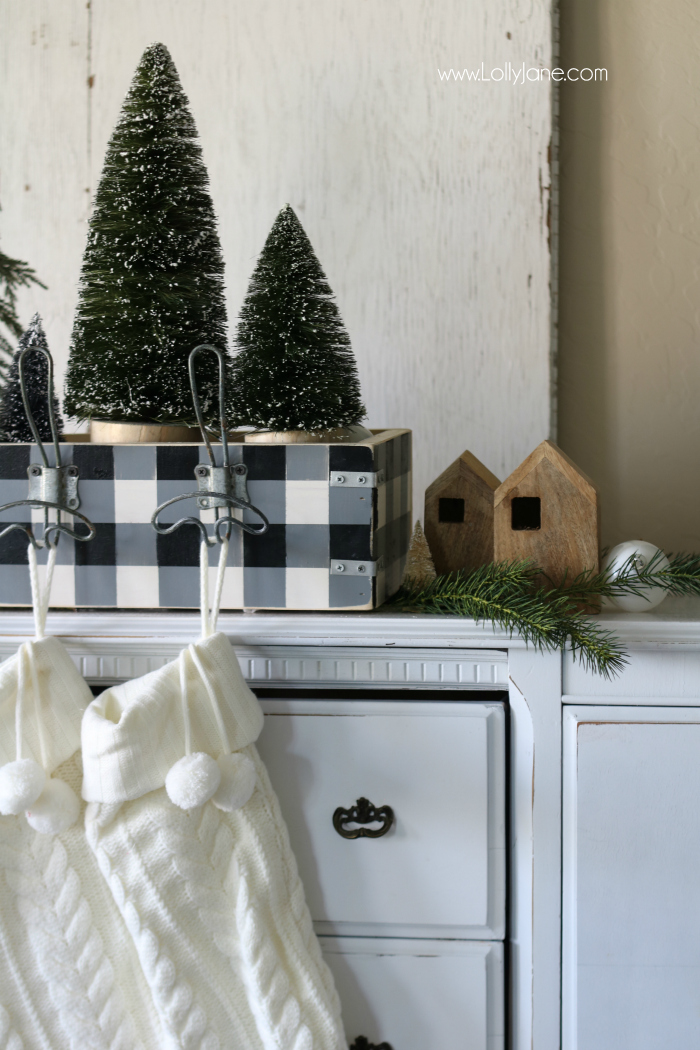 Get creative when hanging your stockings! This easy DIY wood stocking hanger is easy to build and houses cute farmhouse Christmas decor!