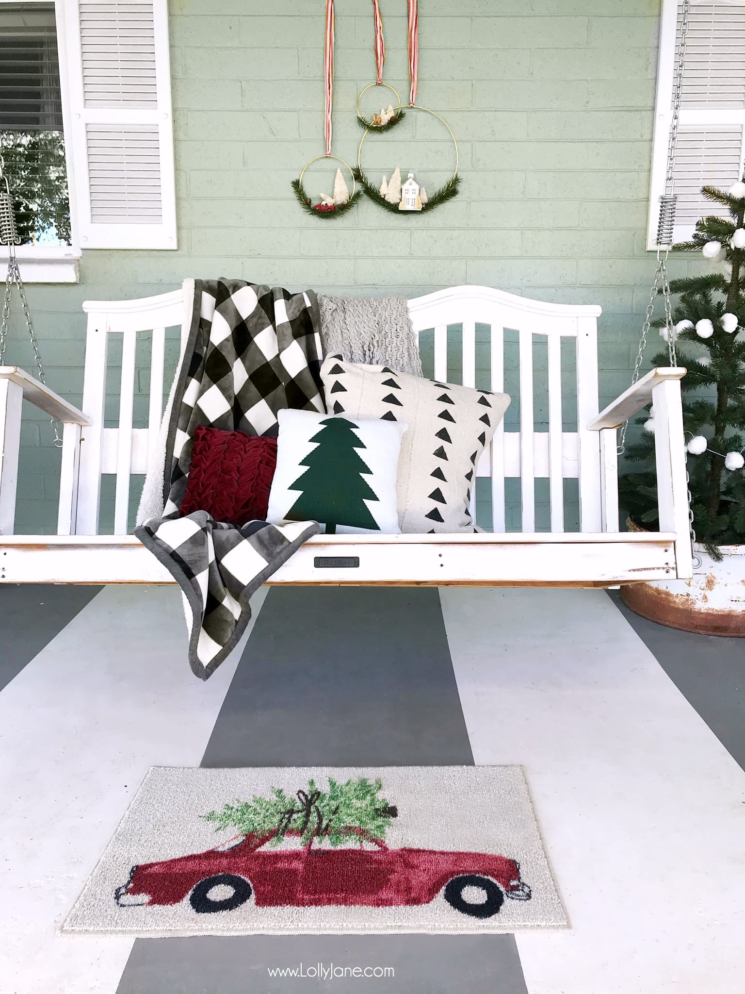 This Christmas porch is just simple and pretty! Mix handmade decor with store bought to make it pop! Love those bottle brush tree wreaths!