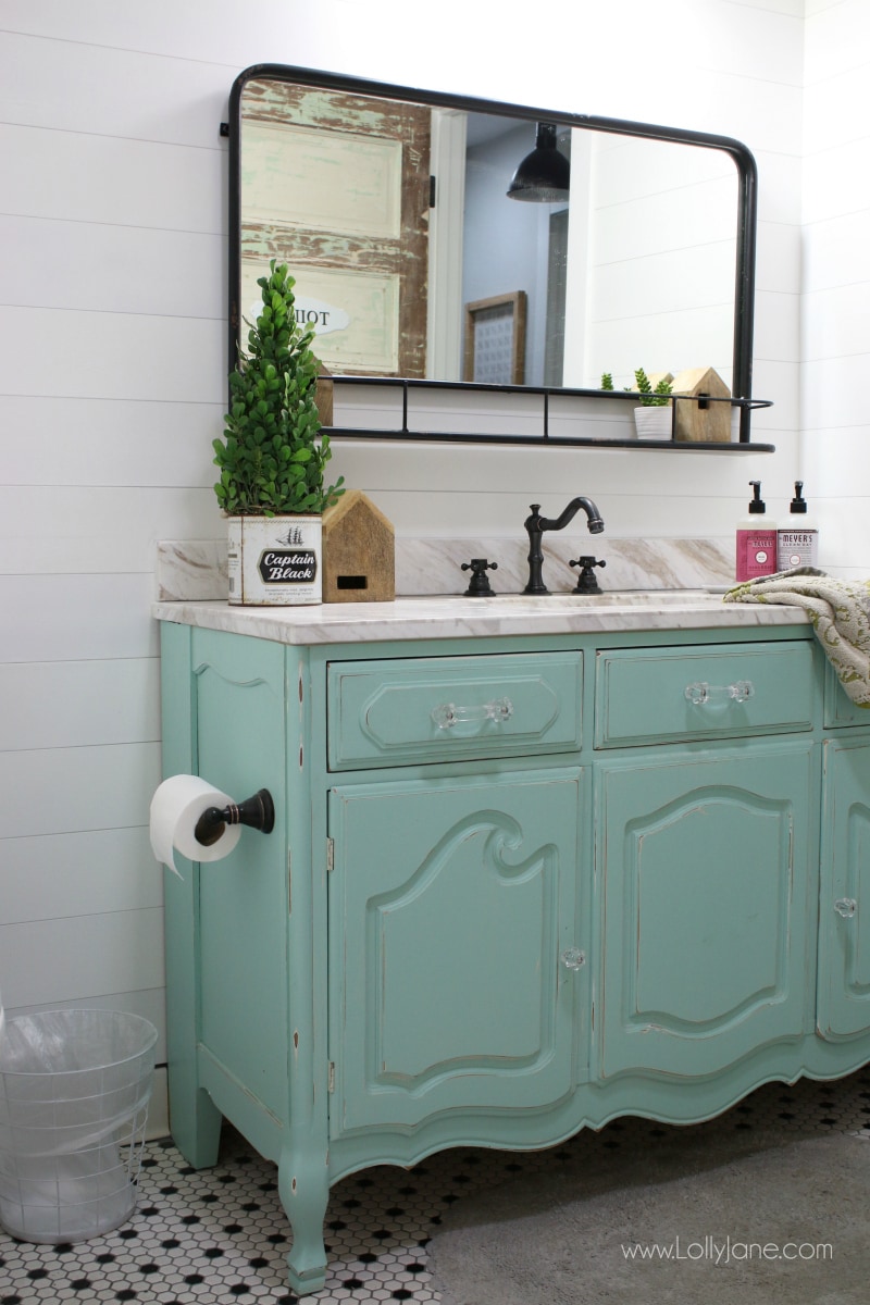 Love this aqua dresser to vanity makeover. Such an easy way to turn an old dresser into a bathroom vanity to give it new life. Love this colorful farmhouse bathroom decor!