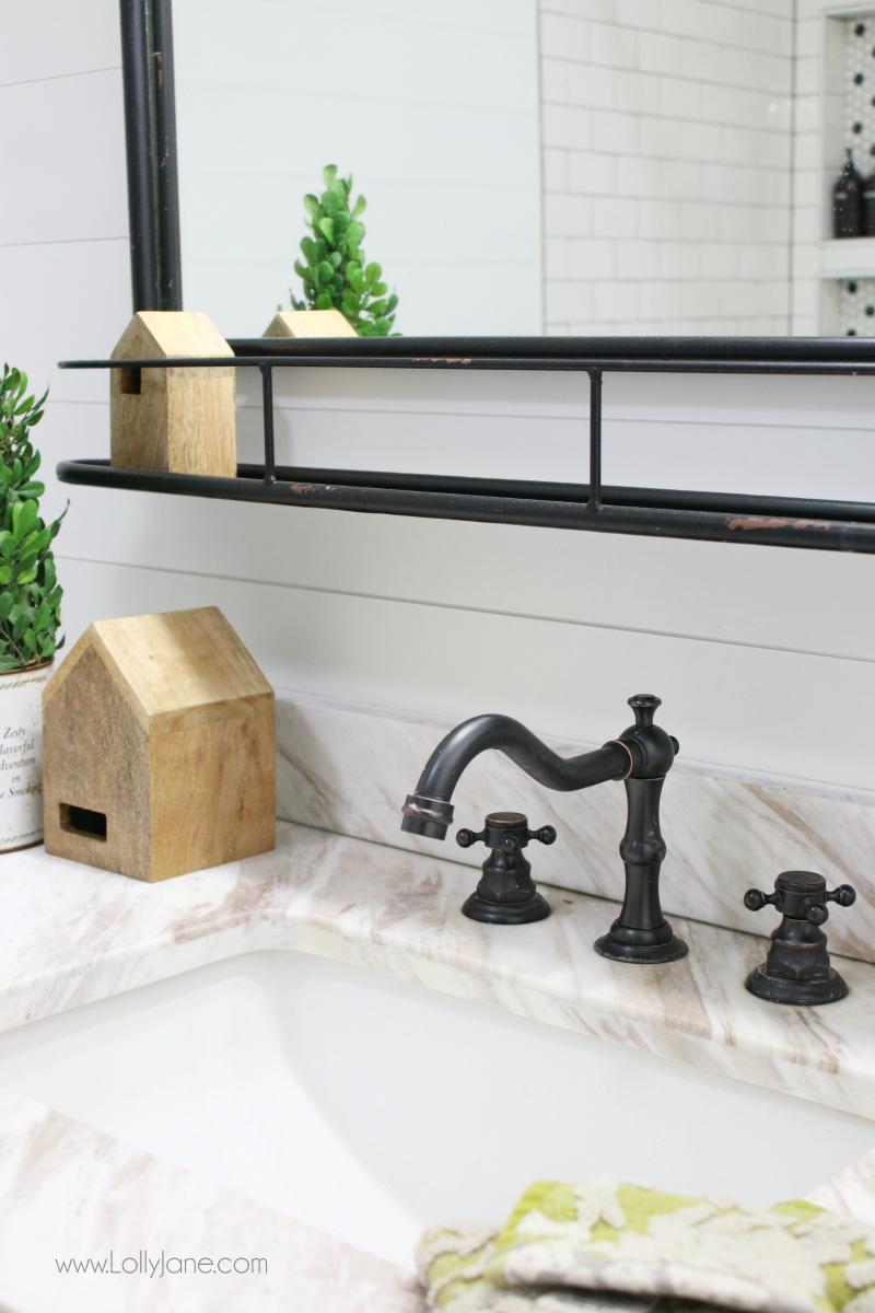 Love these dark finishes on this modern farmhouse bathroom renovation. Such a pretty farmhouse bathroom remodel!