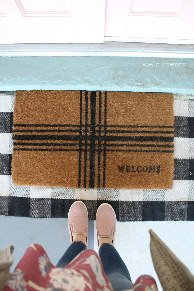 Loving this buffalo check and welcome mat layered rug front porch combo! Such a happy front porch with pink painted doors!