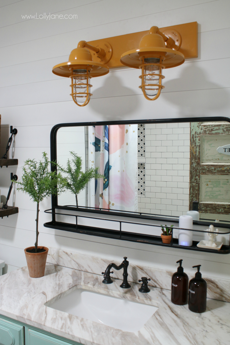 Colorful farmhouse bathroom decor ideas. Love this mustard barn light bathroom vanity, it looks great paired with the aqua DIY vanity!