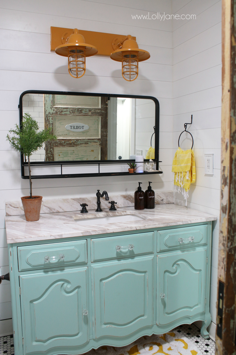 Loving this pharmacy mirror in this farmhouse bathroom decor. Such a pretty pharmacy mirror in our recent bathroom remodel!