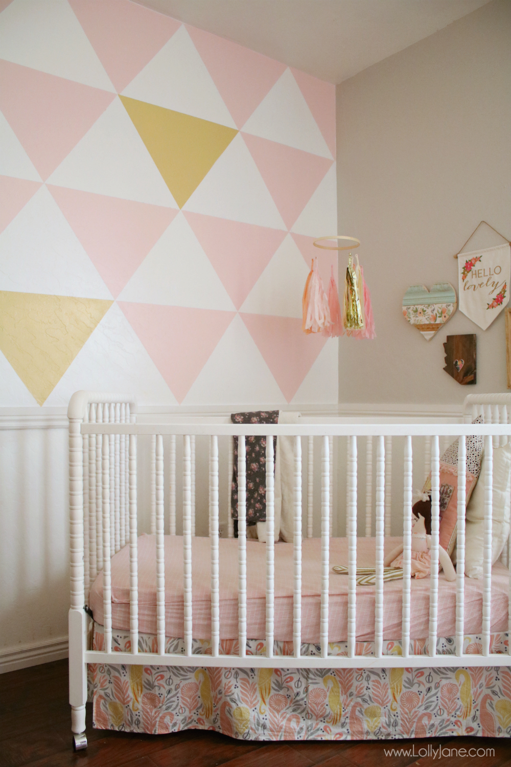 Love this painted geometric accent wall! With a little paint + painters tape, you can completely TRANSFORM a space in just a few hours. 