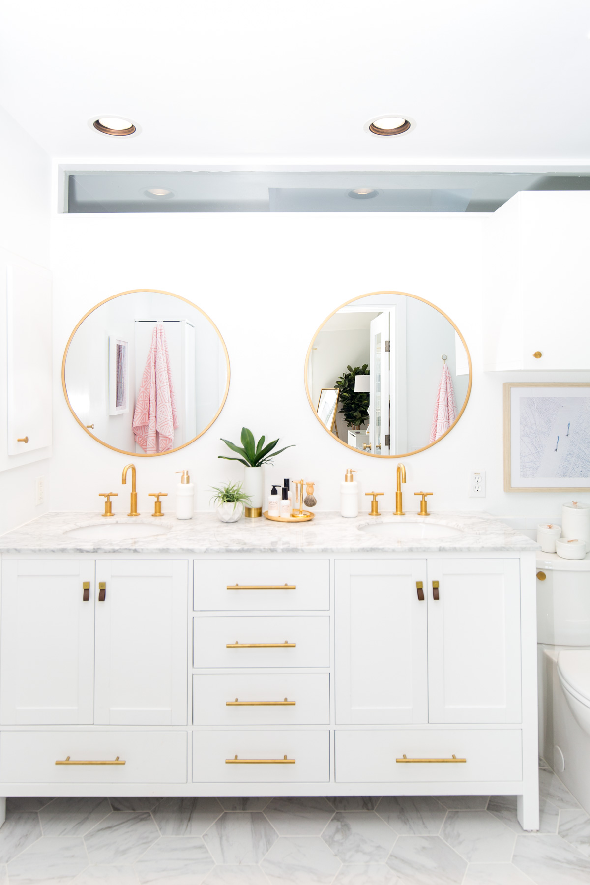 Pretty circle brass rim mirrors in this bathroom remodel make this bathroom decor! Such a pretty bathroom remodel, love it!