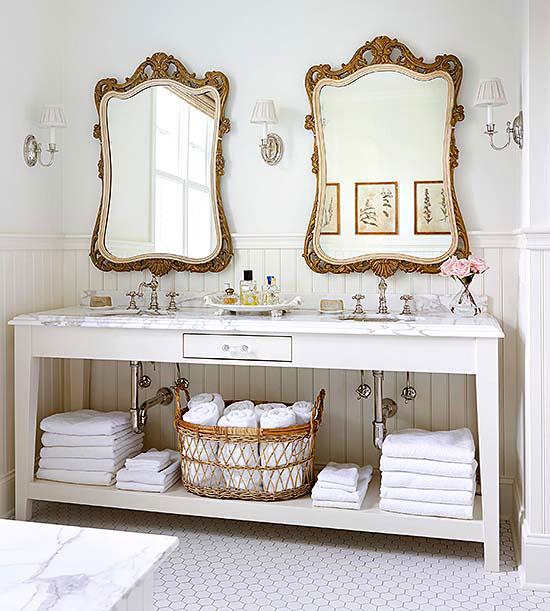 Love these pretty ornate mirrors with a white vanity in this bathroom remodel. Adore this modern bathroom remodel with brass accessories!