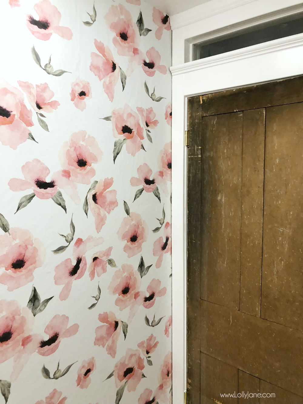 Love this glam farmhouse bathroom with rustic charm! That vintage door is amazing and warms up the space!