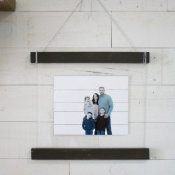 Love this easy to make diy acrylic scroll wall hanging. Such a fun way to display pictures! Love the use of plexiglass + wood, cute wall decor! #diy #shiplap #woodscroll #walldecor #pictureframetutorial