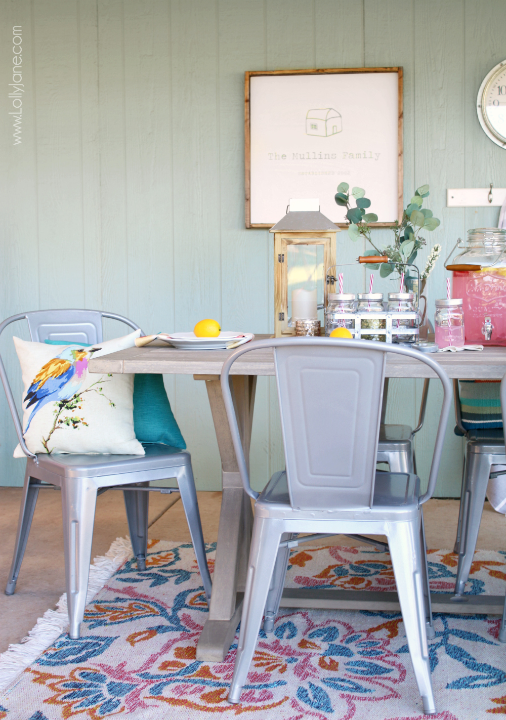 Easy-peasy tips on how to Style Your Porch for Summer. Love the neutral farmhouse table paired with these metal chairs and galvanized accent pieces, so versatile for year-round entertaining!