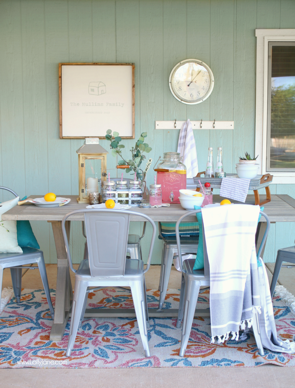 This outdoor tablescape is perfect for summer... so cheery and bright! Love the metal accents and that farmhouse table is dreamy! Great tips to learn how to spruce up your own backyard for summer entertaining!