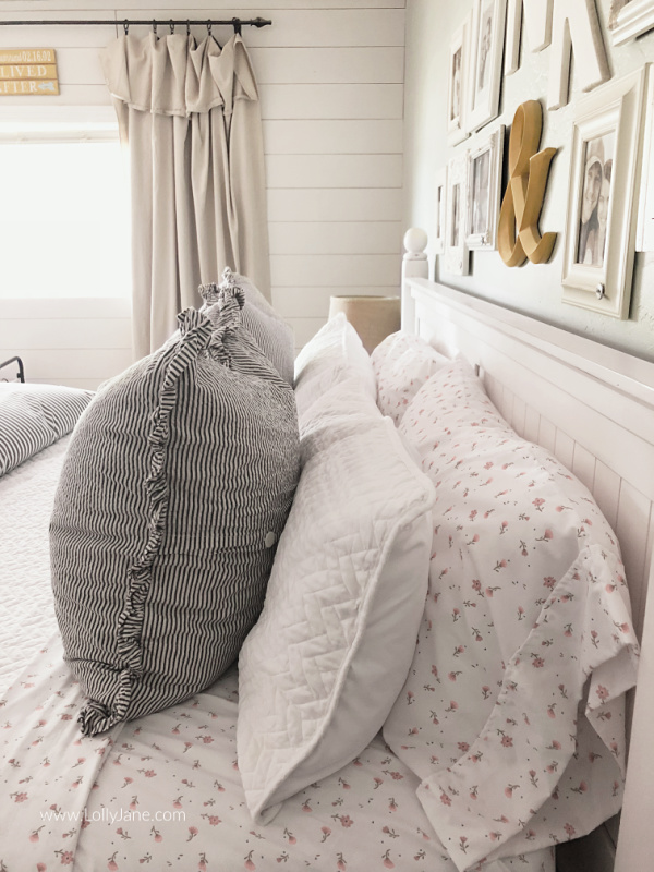 Floral striped bedding master bedroom decor ideas. Love this fun patterned master bedding. Love the layered coverlet and duvet for comfortable bedding you can't wait to sleep in! #masterbedding #farmhousebedding #seersuckerbedding #duvet #coverlet #howtostylebedding #homedecor