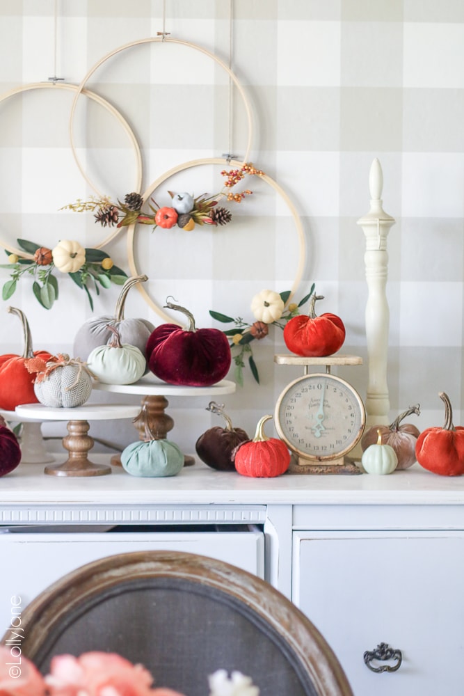These Easy DIY Hoop Wreaths make the PERFECT decor this fall! Add pumpkins, acorns, leaves from your trees, or anything else to spruce up your fall space!