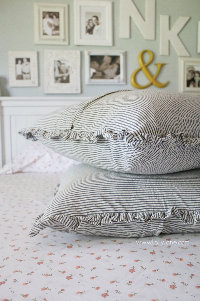 Love these ticking ruffle euro shams in this farmhouse style bedding. Learn how to layer a coverlet on your bed. Fun ways to style your bedding like a pro!