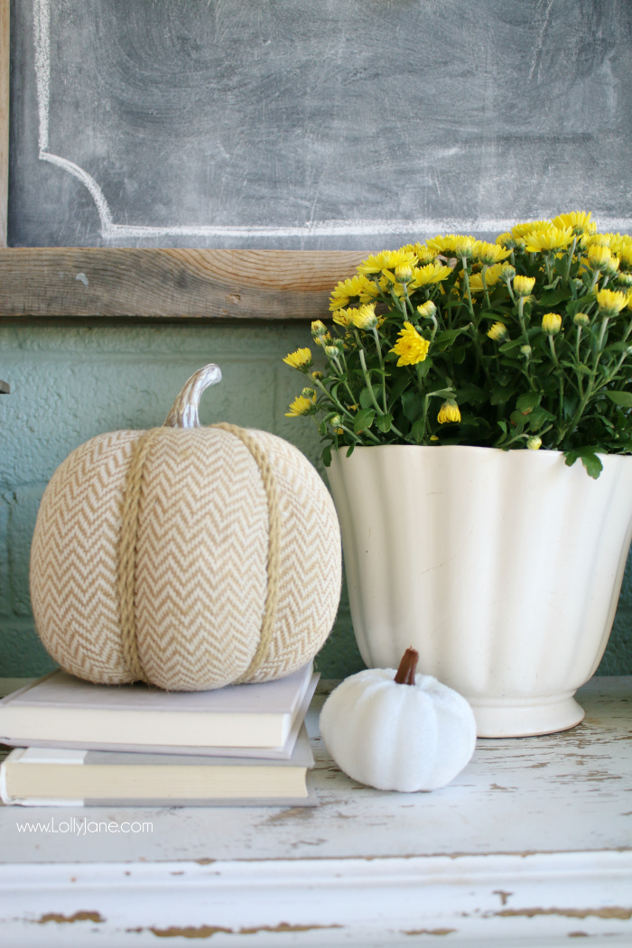 Cheap fall decorations for outside: add fresh mums to old pots, layers fake pumpkins on old books to create inexpensive fall decorations. #falldecor #fallporchdecor #falldecorating #cheapfalldecorideas