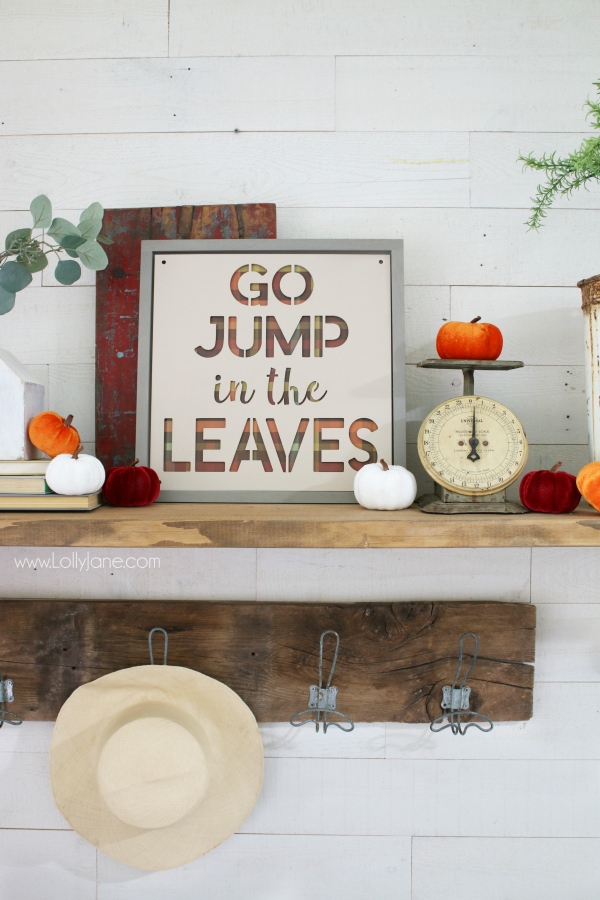 Love this easy to make fall sign! Go jump in the leaves fall sign is the perfect fall mantel decor to remember playing in the leaves as a kid. Love taking fall signs and sayings and turning them into fall signs! Learn how to make this easy fall sign to create a simple fall mantel! #fall #fallsign #fallmantel #falldecor #howto #diy #woodsign #fallideas #falldecorations 