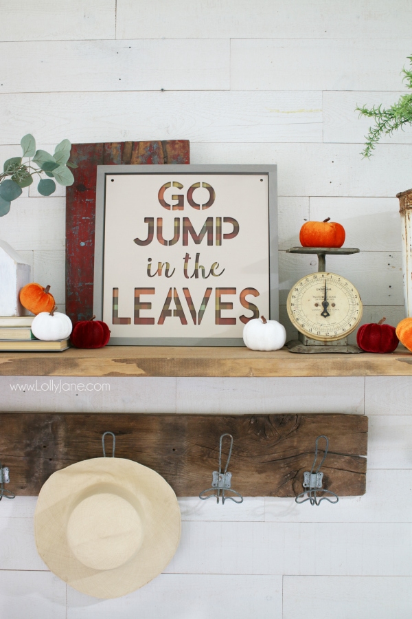 Love this easy to make fall sign! Go jump in the leaves fall sign is the perfect fall mantel decor to remember playing in the leaves as a kid. Love taking fall signs and sayings and turning them into fall signs! Learn how to make this easy fall sign to create a simple fall mantel! #fall #fallsign #fallmantel #falldecor #howto #diy #woodsign #fallideas #falldecorations