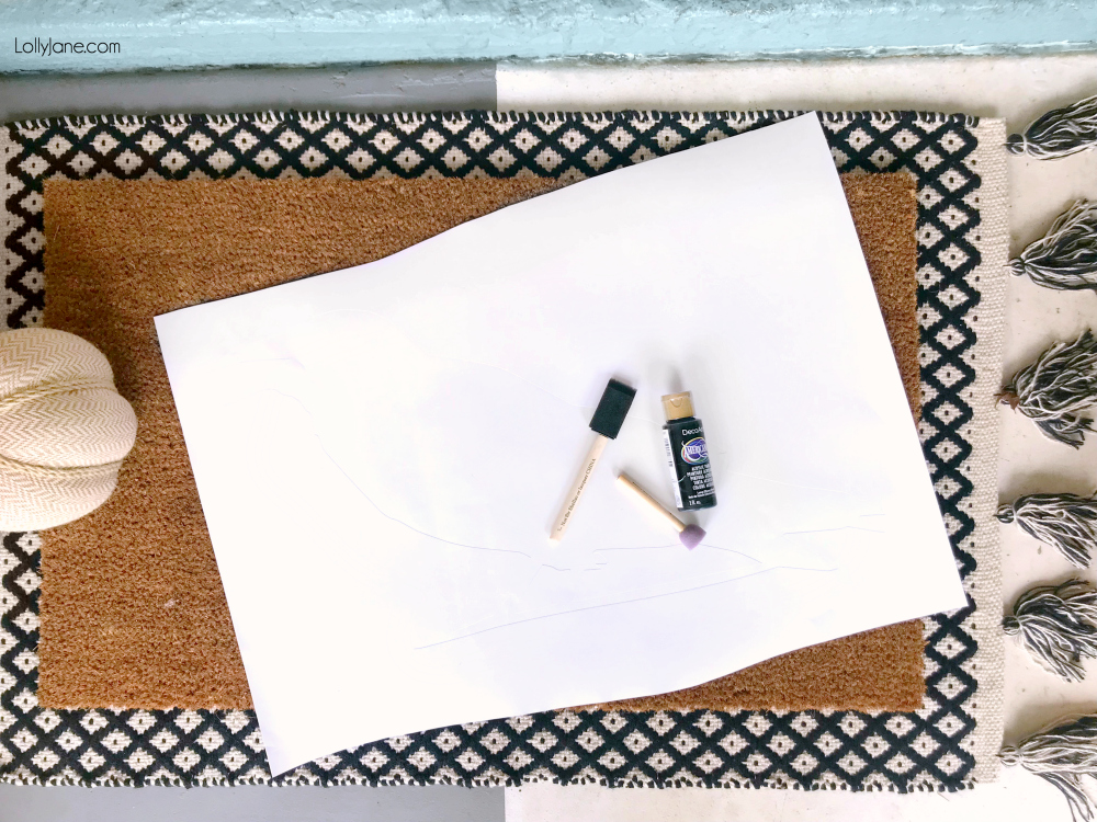 Turn a blank coir doormat into a Halloween work of art in minutes and for under $15! Click picture for the full tutorial at LollyJane.com! #diy #halloweendecor #diydoormat #halloweendecor #crow #halloweendiy