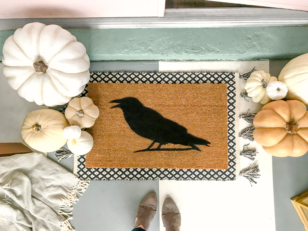 Make this spooky fun Halloween doormat for less than $15 and in minutes! FREE cut file for this cute crow... craft night, anyone? Click picture for the full tutorial at LollyJane.com! #diy #halloweendecor #diydoormat #halloweendecor #crow #halloweendiy