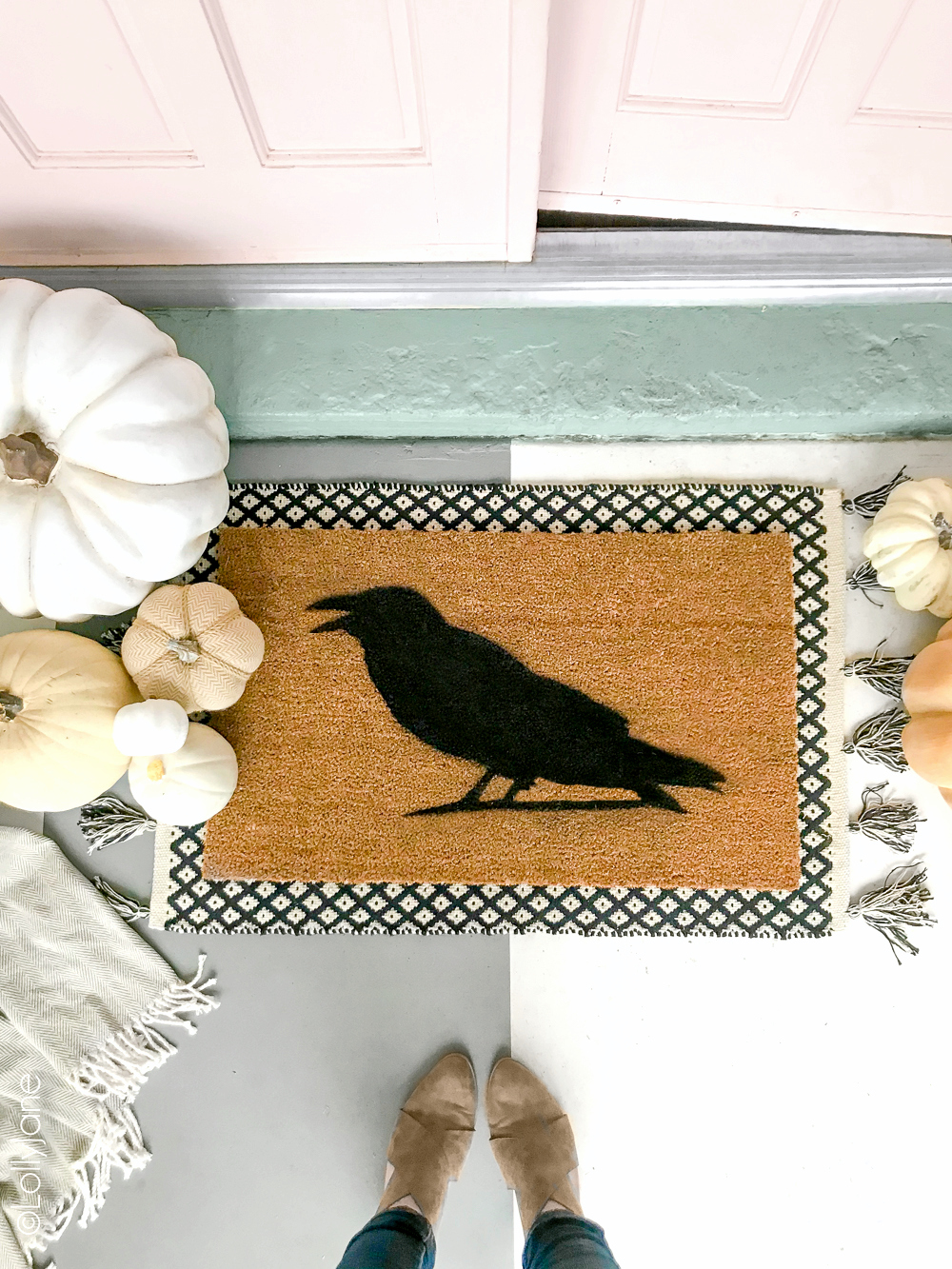 Super cute DIY Halloween Doormat... EASY to make in just minutes and for under $15! Great addition to welcome your spooky guests or trick-or-treaters! Click picture for the full tutorial at LollyJane.com! #diy #halloweendecor #diydoormat #halloweendecor #crow #halloweendiy