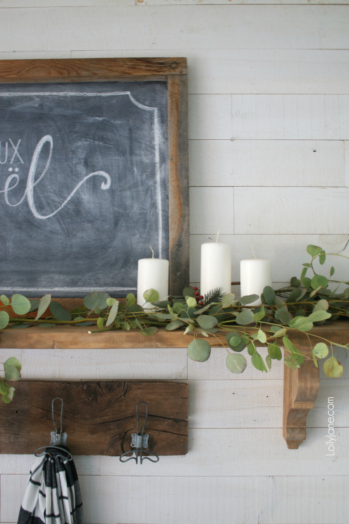 Simple wintery Christmas mantel with chalk art... feel festive without all the frills! Click through to see how this was put together! #diy #christmasdecorations #winterdecor
