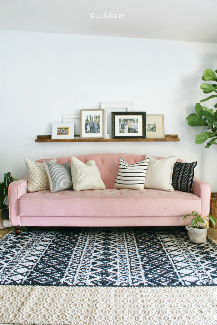 Decorating a boho chic living room. Love the layered rugs and pink velvet couch! #boho #bohostyle #boholiving #boholivingroomdecor