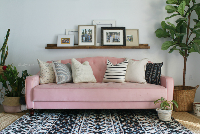 Fun colorful living room with an easy to build wood shelf to display family pictures. Love this mid century modern furniture! #midcenturymodern #modernlivingroom #midcenturydecor