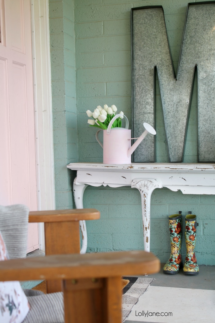 EASIEST MAKEOVER! Spruce up and old or ugly watering can with a little paint... get the full DIY, so simple and perfect for SPRING! Plus, check out these 26 new spring diy project ideas! From easy to make front porch mats to indoor spring decor, we've got you covered with lots of spring decor ideas! #homedecor #topspringideas #freshspringideas #springhomedecor