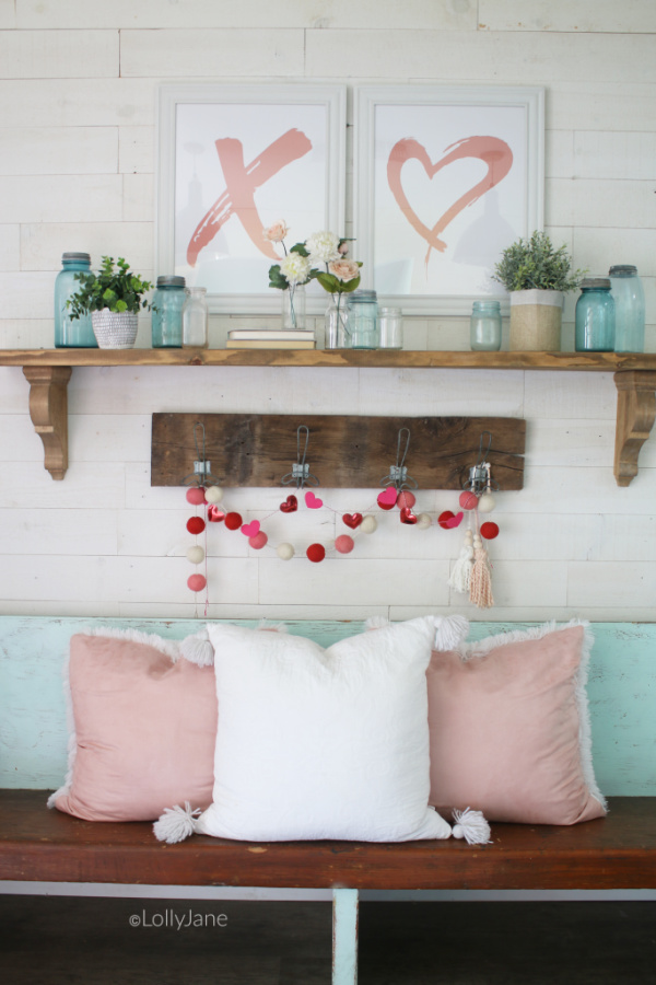 Easy to put together Valentines Day mantel | Such a fun pink and aqua VDay mantel idea! Don't forget to decorate your entryway for Valentines Day! #vintagevalentinesday #valentinesdaydecor #vdaydecor #vdaymantel #valentinesdaymantel #bluemasonjarcollection #pinkvaletinesdaydecor