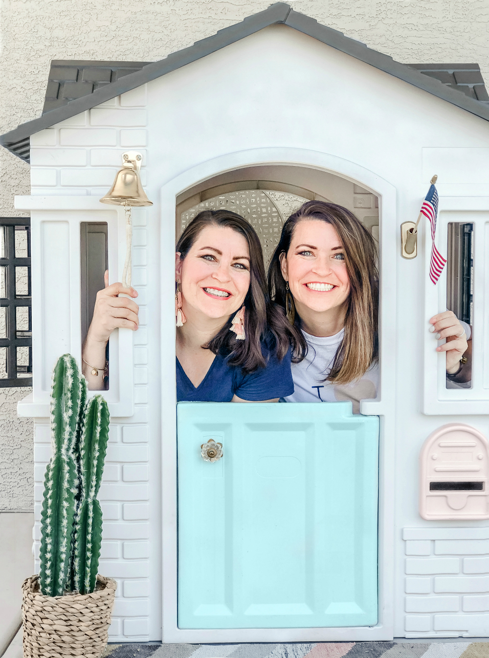 Twin sister DIYers LollyJane.com Kristi + Kelli transformed this plastic playhouse in no time at all-- click to see the before and how-to! Amazing! #diy #playhousemakeover