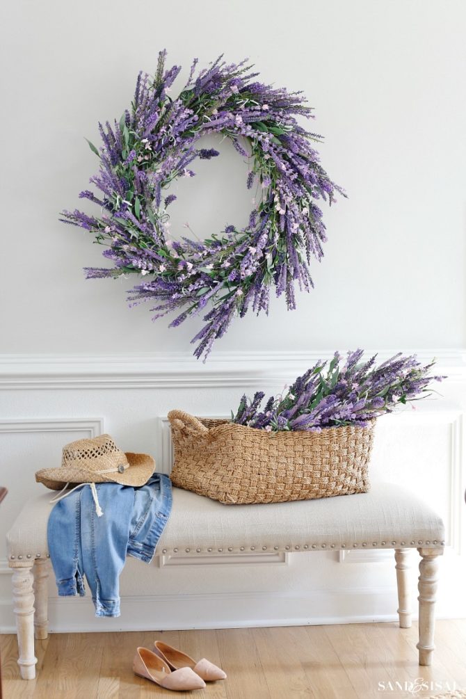 Adore these faux lavender decorating ideas, just place the in a slouchy basket and hang a lavender wreath, so easy and so pretty! #lavenderdecor #lavenderwreath #fauxlavender #decoratingideas #decoratingwithlavender