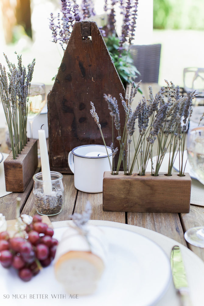 Love this DIY Flower Display filled with lavender stems. Easy outdoor porch decor, so pretty! #decoratingwithlavender #diyflowerholder #diyflowerdisplay #porchdecor #porchdecorations #diyhomedecor