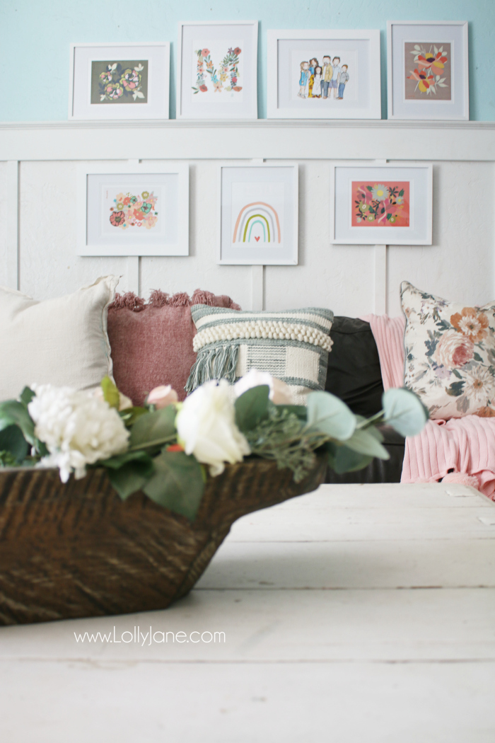 Fun eclectic gallery wall with floral prints, watercolor rainbow and a hand painted family picture. #eclecticgallerywall #walldecor #gallerywall #familyroomdecor #bohodecor