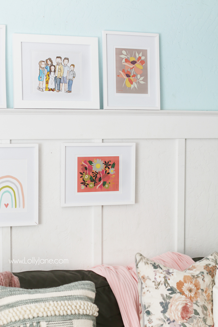 Gallery wall family room floral prints. Love this eclectic gallery wall featuring pink decor, floral prints and a watercolor rainbow print. #floraldecor #gallerywall #familyroomwalldecor #walldecorations #gallerywallideas