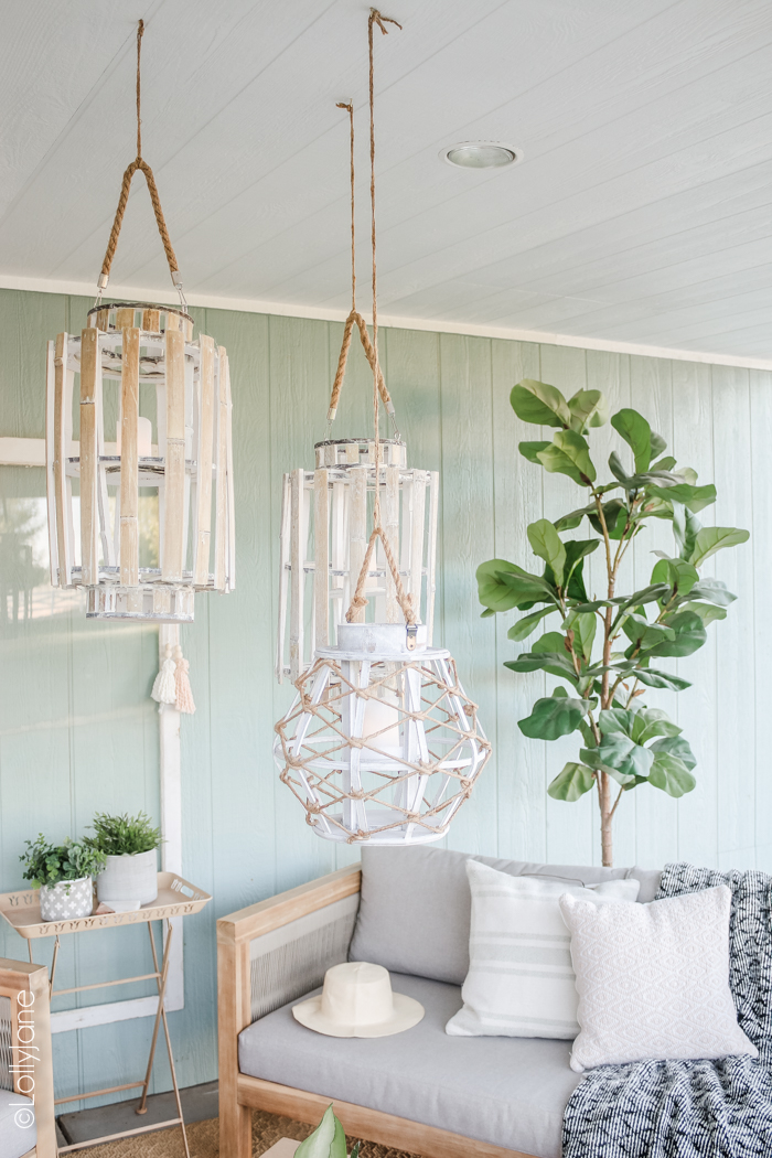 Group a trio of lanterns to pull a coastal vibe and cozy up an outdoor space! Love this farmhouse porch! #farmhousestyle #farmhouse #coastalstyle #driftwood #patio