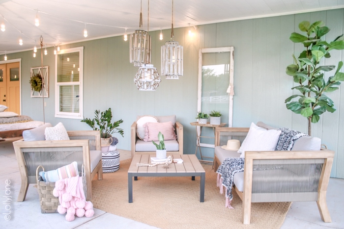 Loving this cozy coastal farmhouse outdoor space! Read through to see how to cozy up your own outdoor living areas! #coastal #coastalstyle #farmhouse #patio #porch #summertime