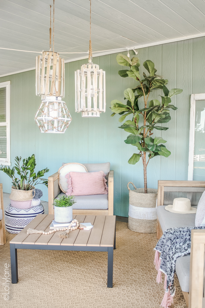 Loving this cozy coastal farmhouse outdoor space! Read through to see how to cozy up your own outdoor living areas! #coastal #coastalstyle #farmhouse #patio #porch #summertime