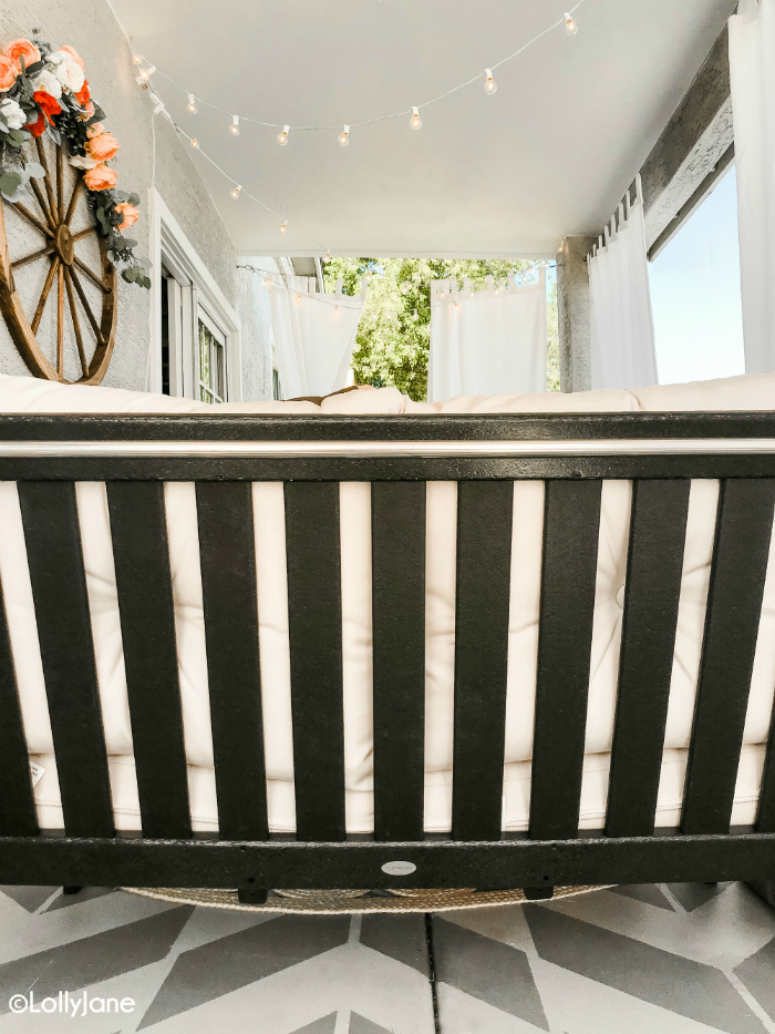 Loving our Polywood patio furniture. This modern farmhouse painted porch is so easy to replicate with an easy to paint stencil concrete floor, dark furniture and cozy linens. The perfect way to wind down after a long day. #patioset #modernfarmhouse #outdoorfurniture #paintedporch #stencilflooring #paintedconcrete