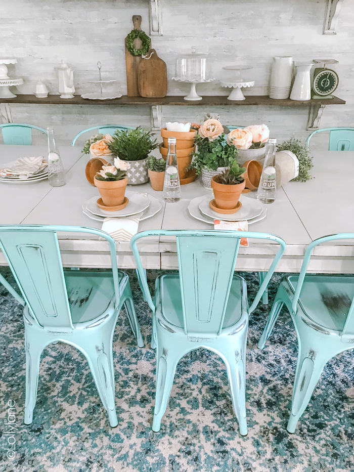Gather simple pots together and layer with greenery and faux florals then pair with dinnerware for a SIMPLE spring or summer tablescape! So cute!