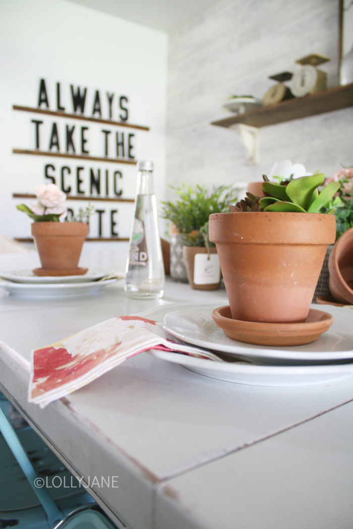 Summer table decorations are the perfect way to share your creativity. If you're hosting your own party or dinner this warm season, consider faux succulents and florals to add some color to your dining room table summer centerpieces. #summerdecorations #summercenterpieces #summertablescapes #summerdecor #diningroomtabledecor