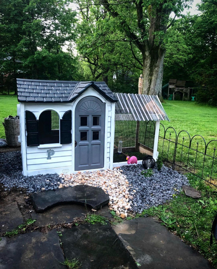 Need a playhouse that is animal friendly? #woodenplayhousemakeover #diyplayhousemakeover #costcoplayhousehack #playhousehack