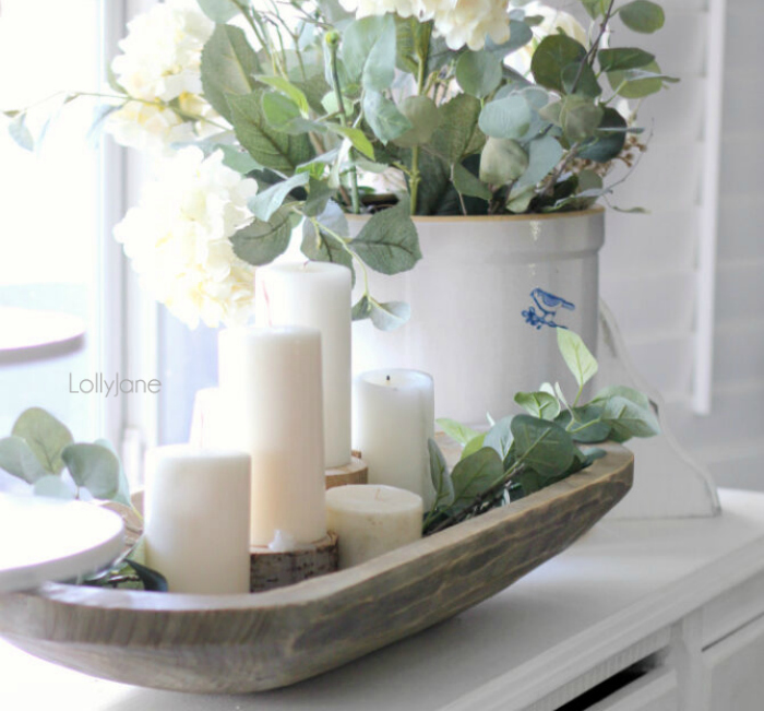So many fun ways to style dough bowls! We love to fill a dough bowl with candles and greenery for an easy centerpiece idea! Easy home decorating ideas using an old dough bowl and candles. #doughbowl #vintagedoughbowl #howtousedoughbowl #howtostyledoughbowl #doughbowlhomedecor