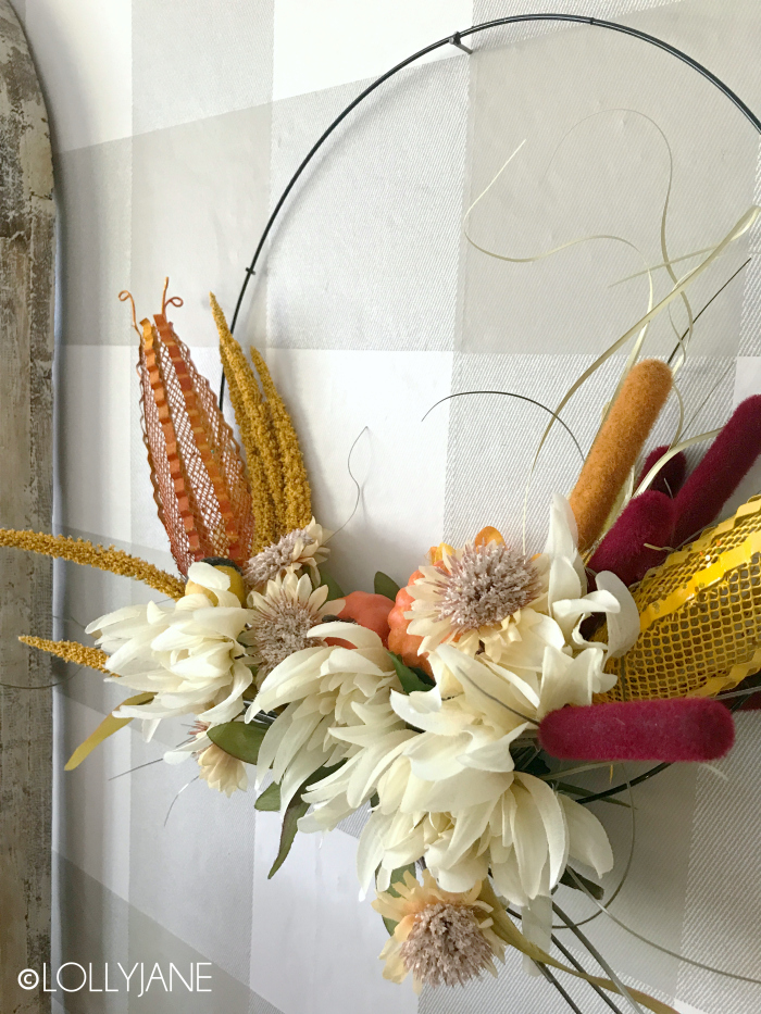 Dollar Store crafts, fall style?! SO PRETTY! This wreath was less than $10 to make and took less than an hour, wow! Stunning! #diy #HomeDecor #fallwreath #dollarstorecrafts #hoopwreath #holidaycrafts